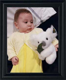 Baby with Snowy the koala